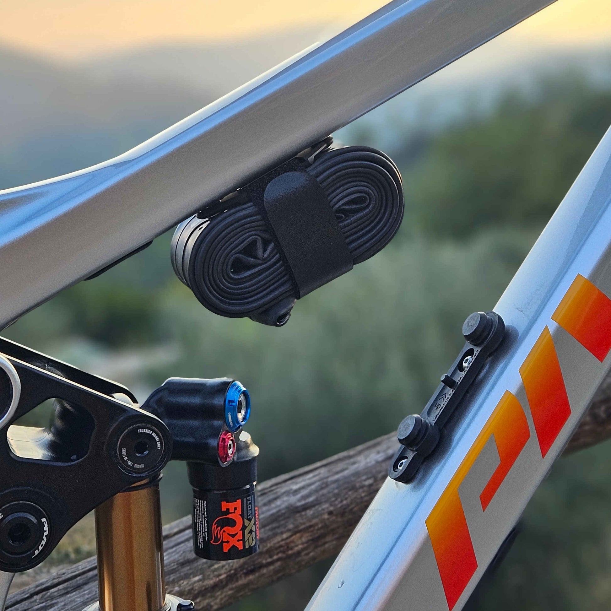 ZINE Tube Cage installed on a bike frame, compact storage solution for spare tubes and cycling tools.