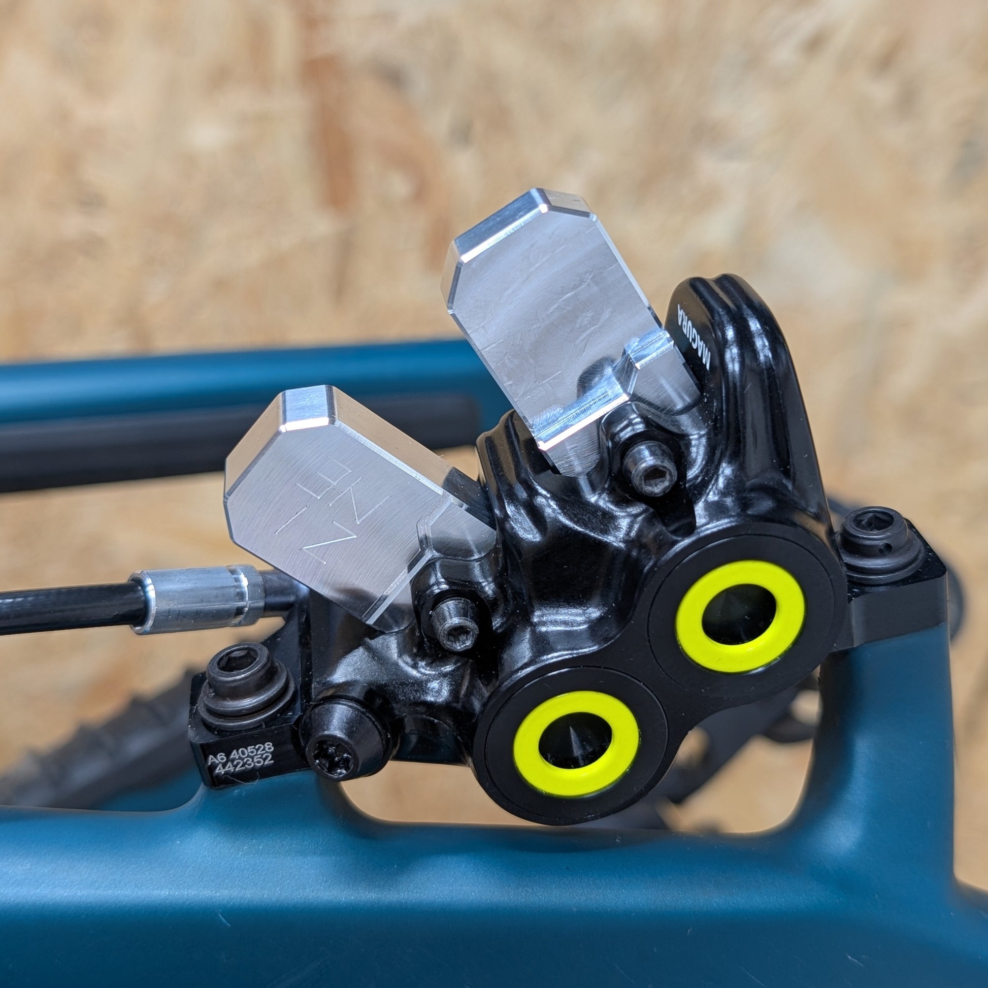 ZINE aluminum bleed block inserted into the caliperof a magura brake for piston massage mobilization during the bleeding process.